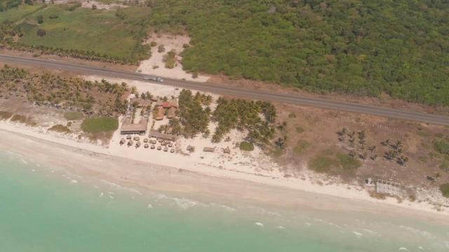 Land between the Federal Maritime Zone and Isla Aguada Highway